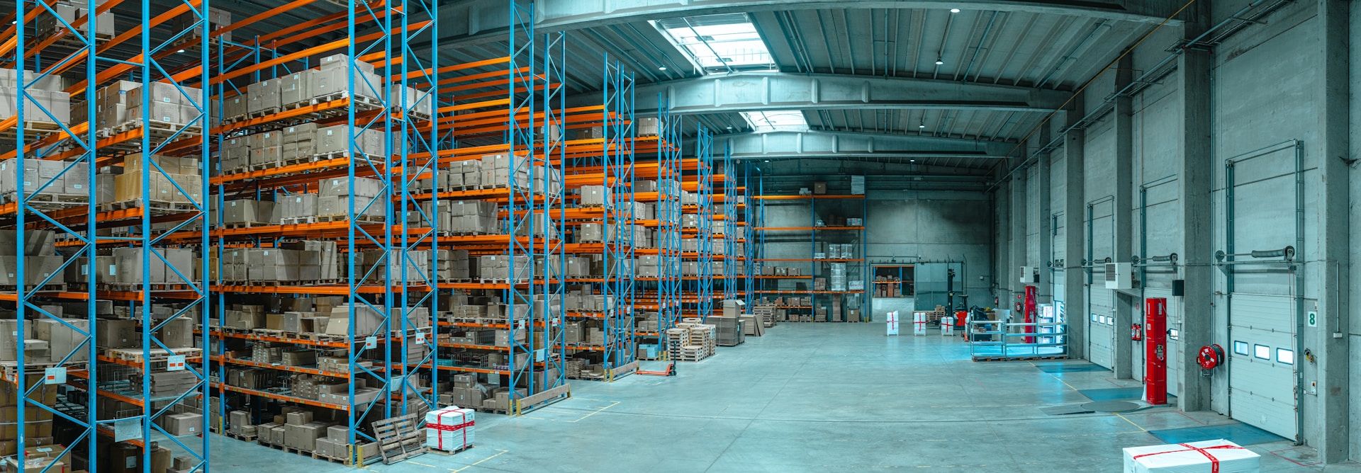 What is a distribution center and how does it differ from a warehouse?